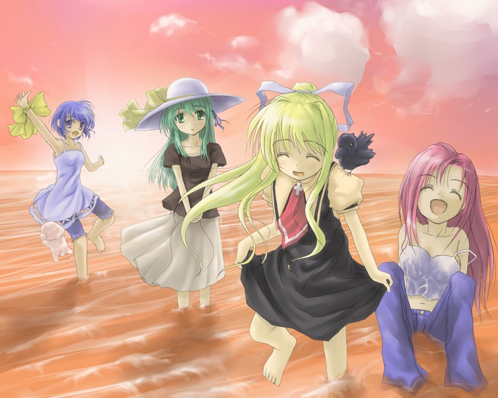 Four girls on a beach at sunset