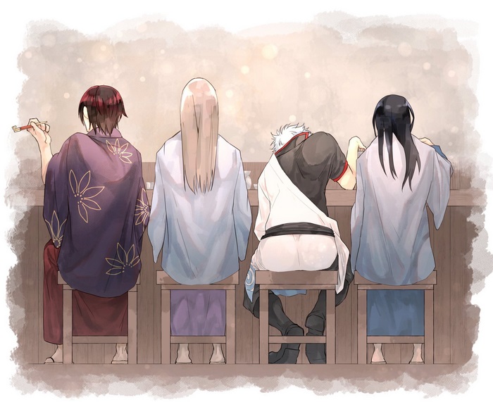 Four men sitting at a counter