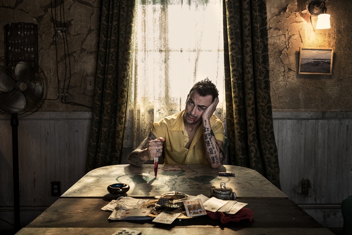 Cassidy (Preacher) holding a bloody knife