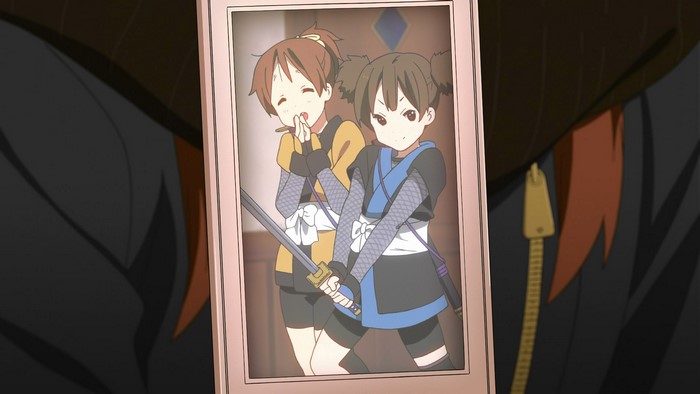 Two girls in ninja outfits with swords