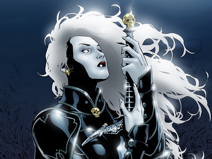 Lady Death holding a skull-topped staff
