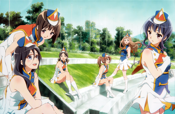 Girls in marching band uniforms on a sunny day