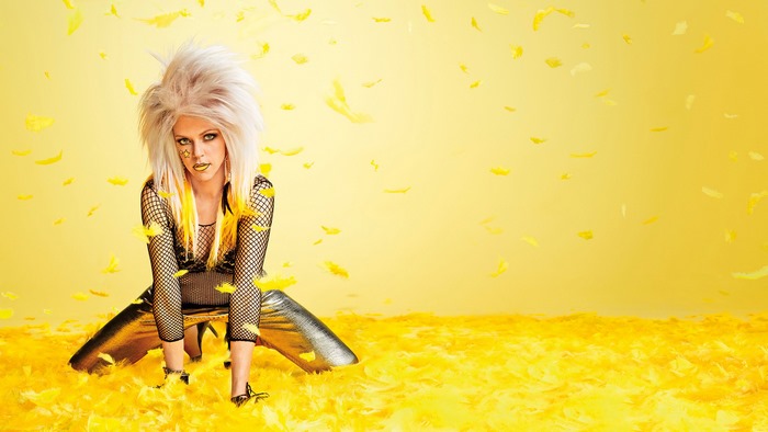 Deandra Reynolds with yellow feathers