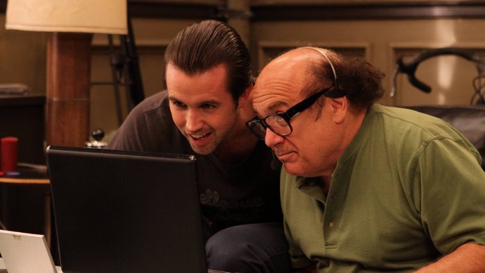 Mac and Frank from It's Always Sunny in Philadelphia looking at a laptop
