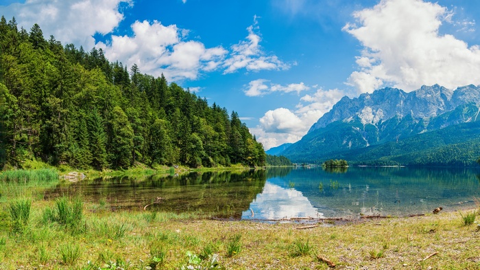 Lake and mountains with a forest on the left