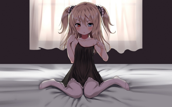 Kobato Hasegawa sitting on a bed