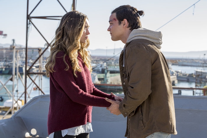 Alicia Clark and a young man holding hands