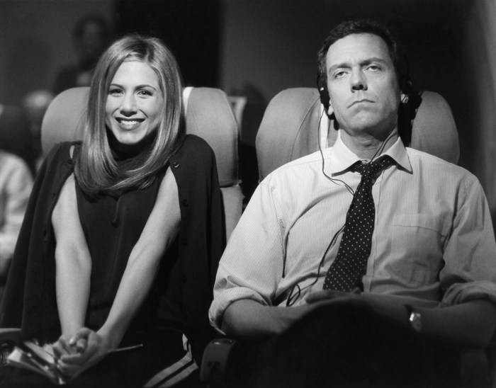 Jennifer Aniston and Hugh Laurie on an airplane