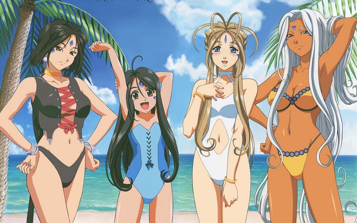 Four women in swimsuits on a beach
