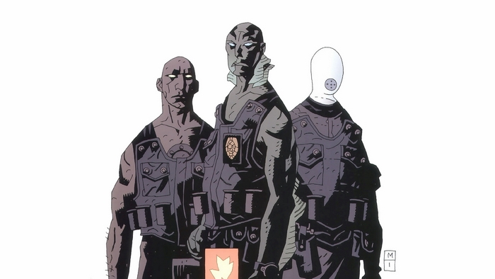 Three figures in tactical gear