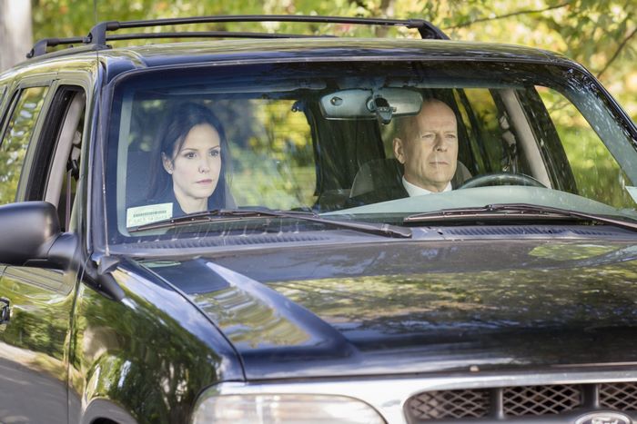 Frank Moses and woman in a black SUV