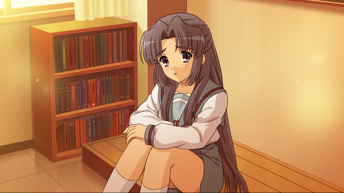 Ryōko Asakura sitting in a room