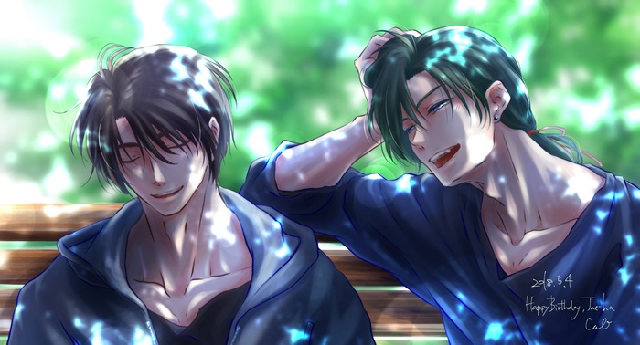 Two men sitting on a bench outdoors