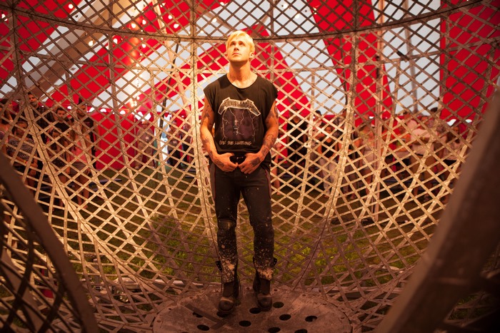 Luke from The Place Beyond the Pines in a motorcycle stunt globe