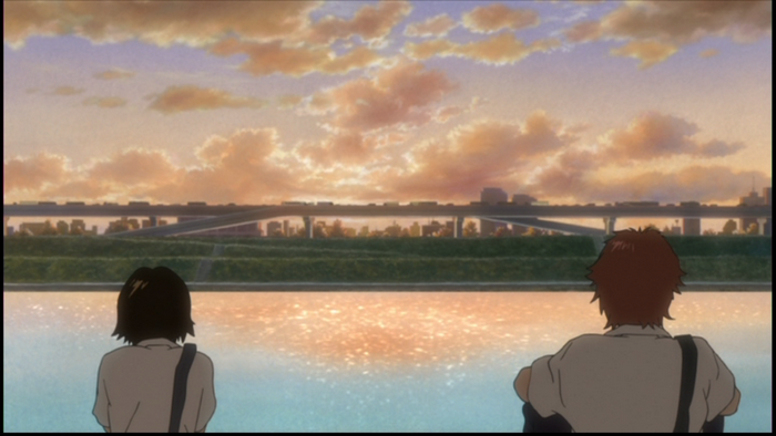Makoto Konno by the river at sunset