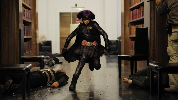 Hit-Girl from Kick-Ass in a library