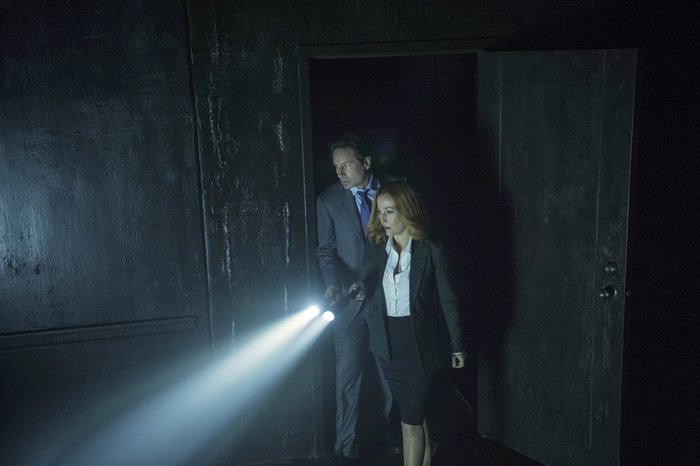 Fox Mulder and Dana Scully in a dark room