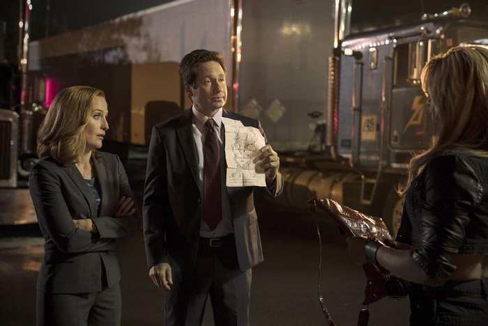 Fox Mulder and Dana Scully with a woman