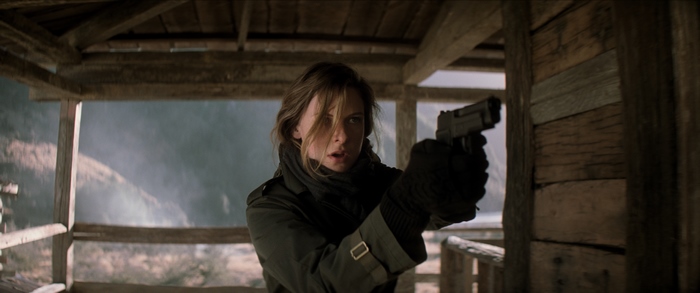 Ilsa Faust holding a gun