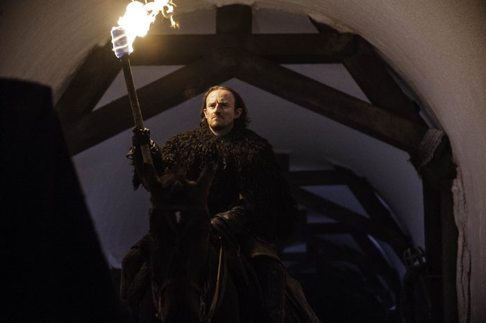 Dolorous Edd from Game of Thrones on horseback with torch