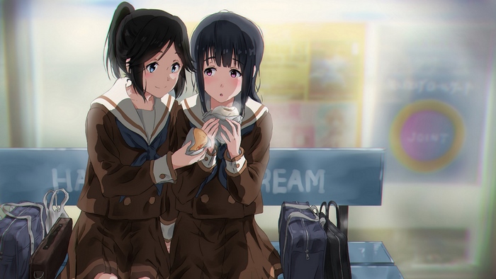 Two girls in school uniforms sharing food