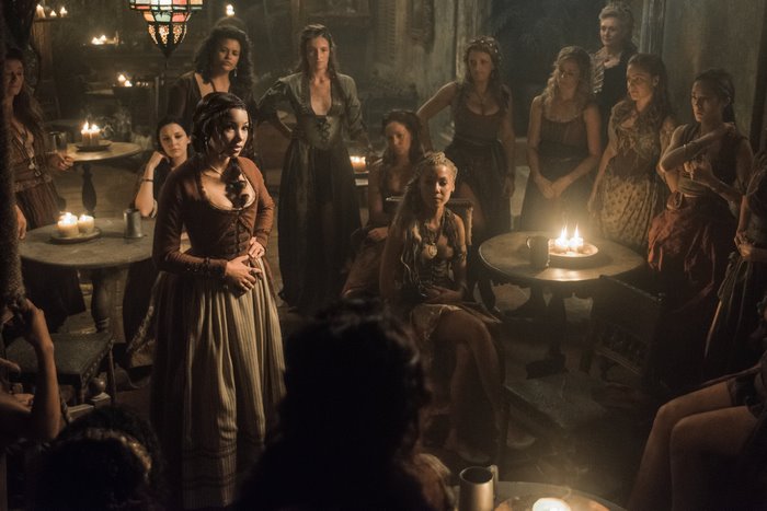 Women gathered in a dimly lit room