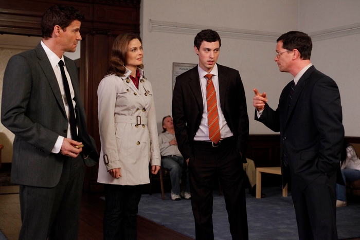 Lance Sweets and colleagues in a room