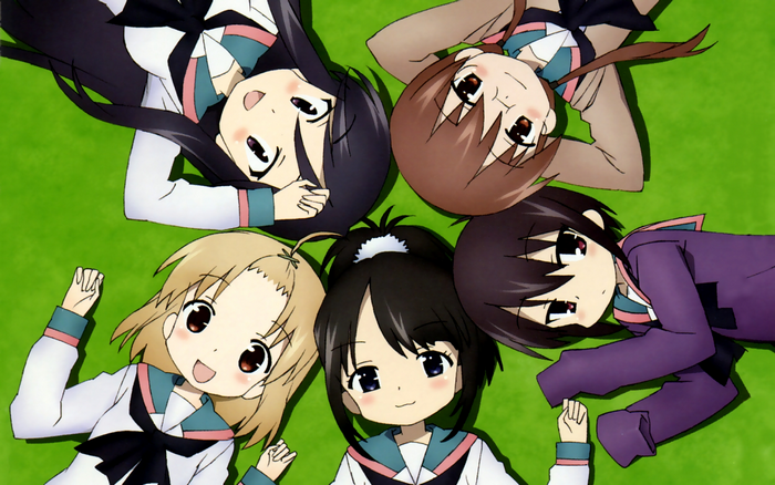 Five girls lying on grass