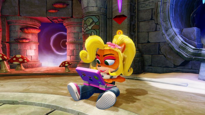 Coco Bandicoot from Crash Bandicoot playing on a laptop