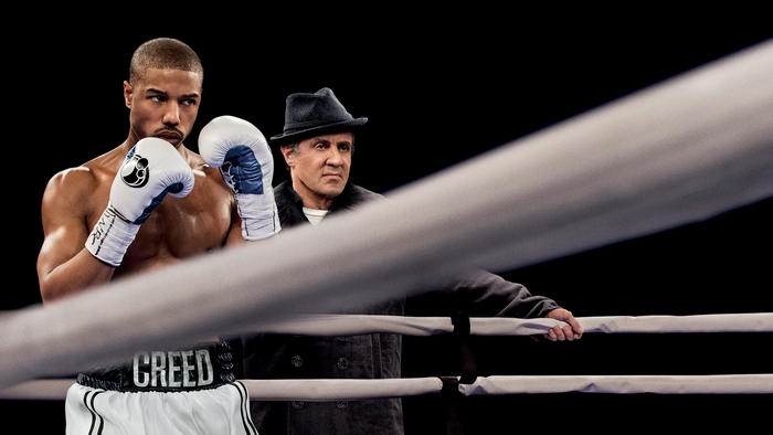 Adonis Creed and Rocky Balboa in a boxing ring