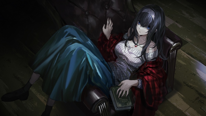 Fumika Sagisawa sitting on a couch with a book