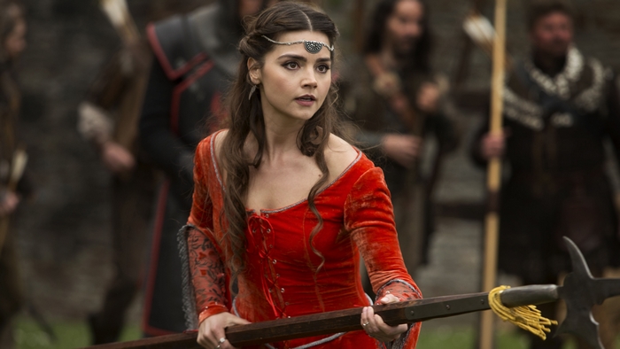Clara Oswald holding a weapon