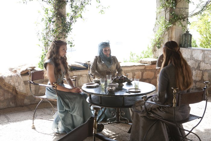 Olenna Tyrell and two women at a table