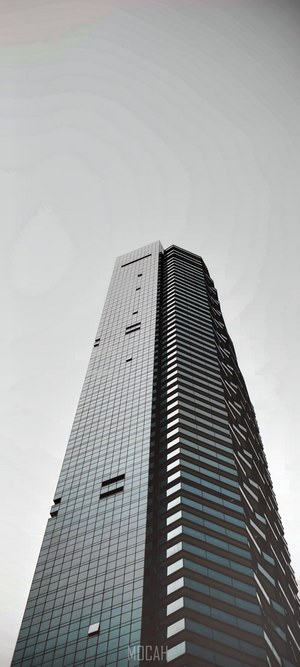 Tall skyscraper with black glass facade