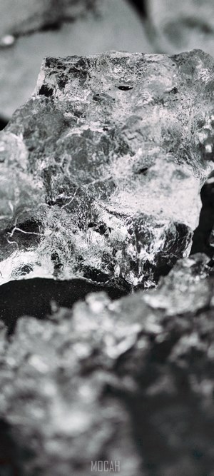 Close-up of ice crystals on dark soil