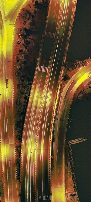Aerial view of a highway at night with light trails