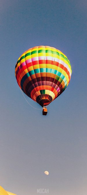 Hot air balloon flying near the moon