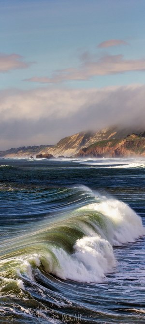 Ocean waves crashing against a rocky coastline