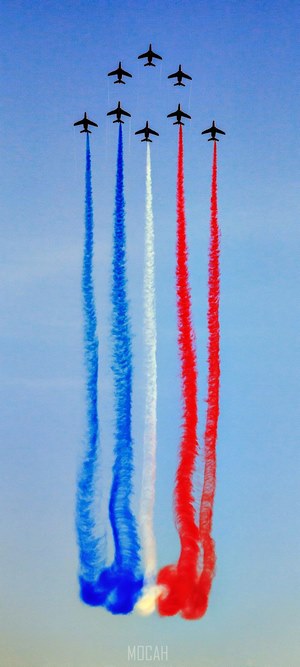 Patrouille de France jets create red, white, and blue smoke