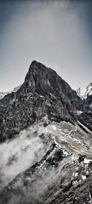 Misty fog wraps around snowy Bunderspitz mountain