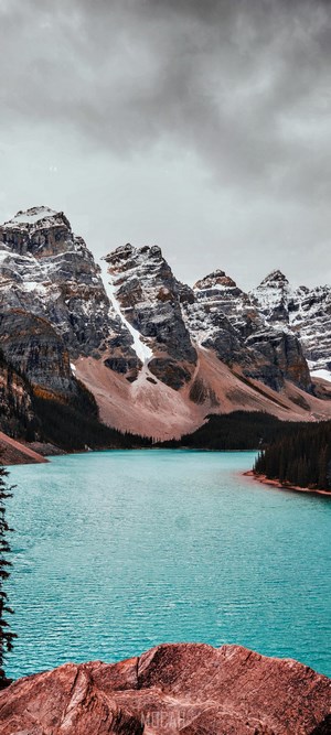 Moraine Lake with snow-capped mountains and turquoise water