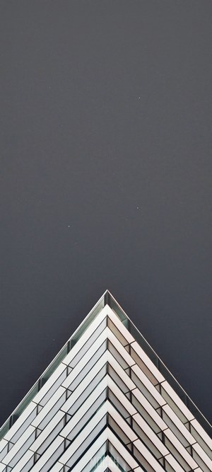 Modern building corner against dark sky