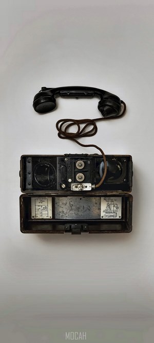 Vintage telephone with handset and open case