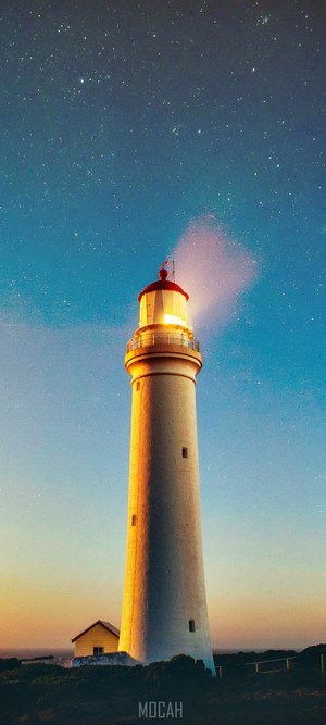 Lighthouse at twilight with stars