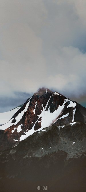Mountain landscape with snow and clouds