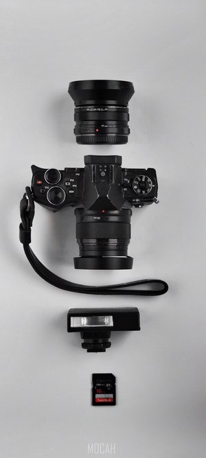 Olympus camera with lens, flash, and SD card