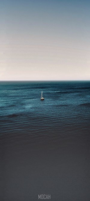 Sailboat on the ocean with a gradient sky