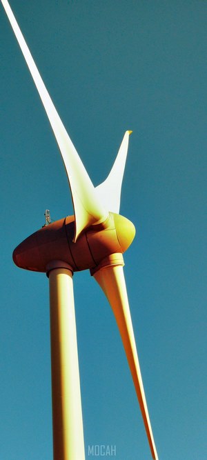 Wind turbine against a clear blue sky
