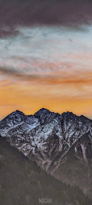 Snow-capped mountains at dawn
