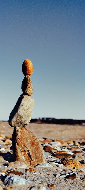 Balanced stones on a beach